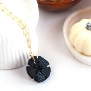 Black Sand Dollar Pendant Necklace by MK Designs